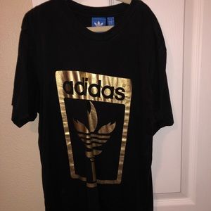 Adidas black and gold tee